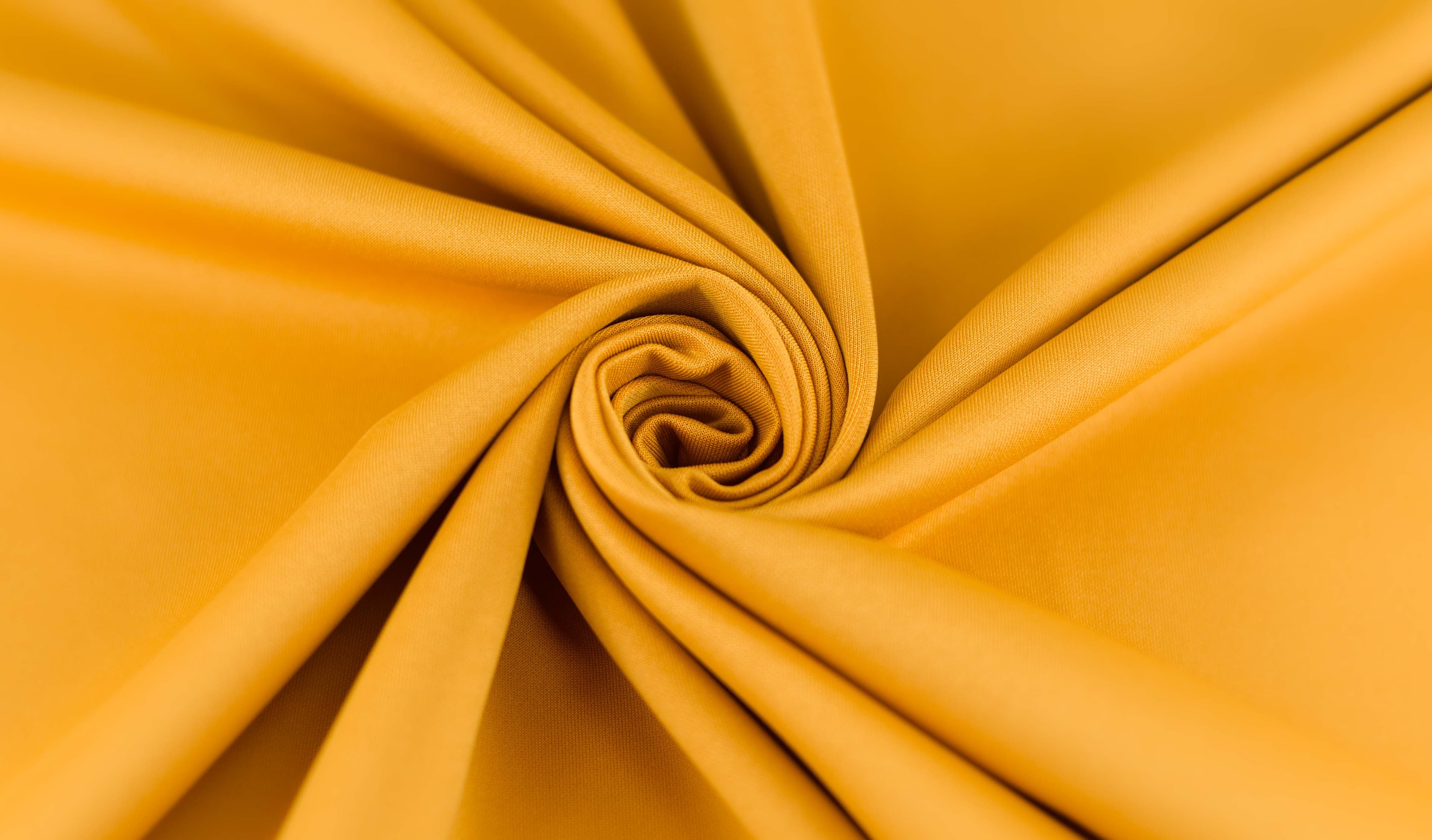 Mustard cloth twirled in floral pattern