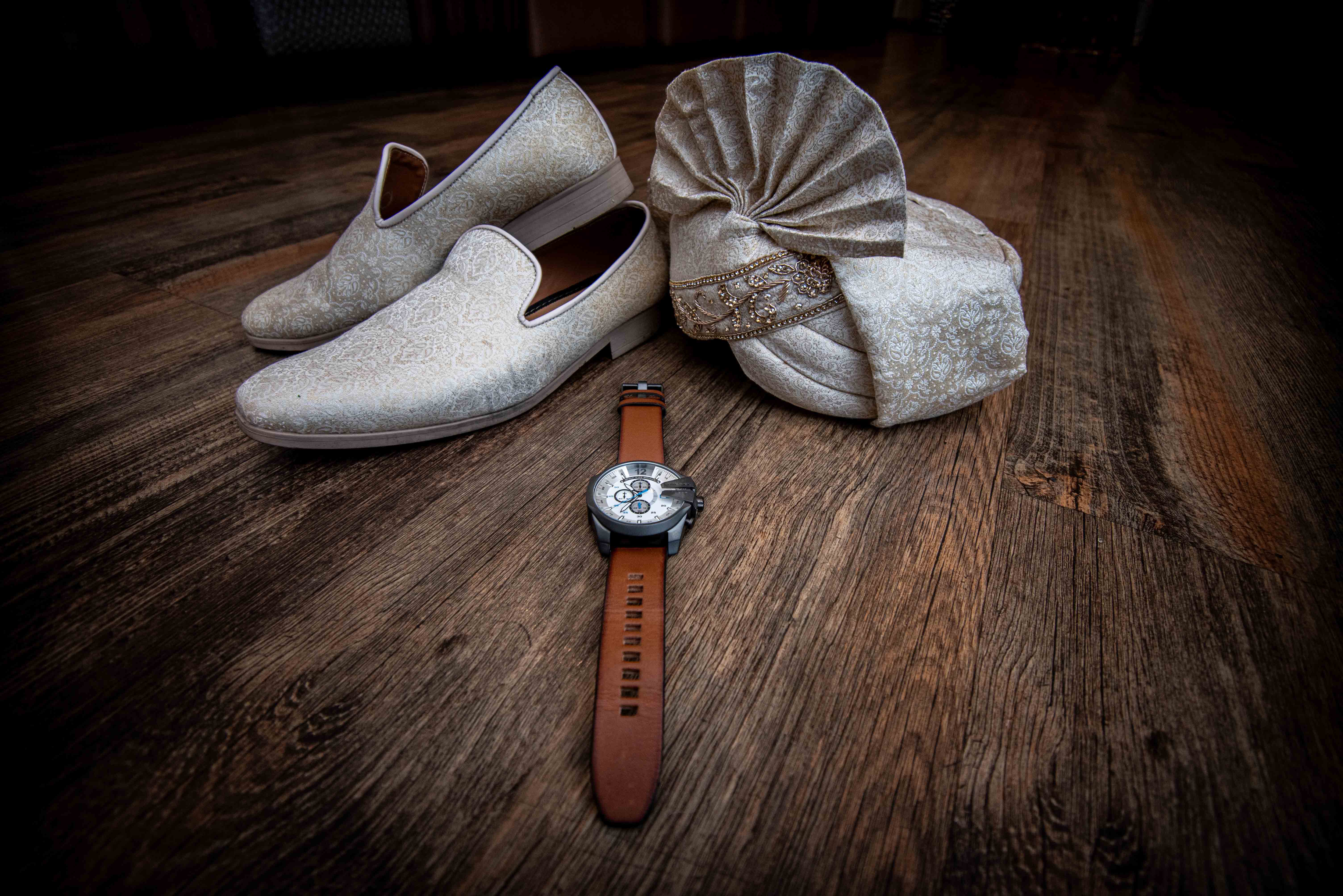 A groom's wedding essentials, shoes, watch and traditional turban