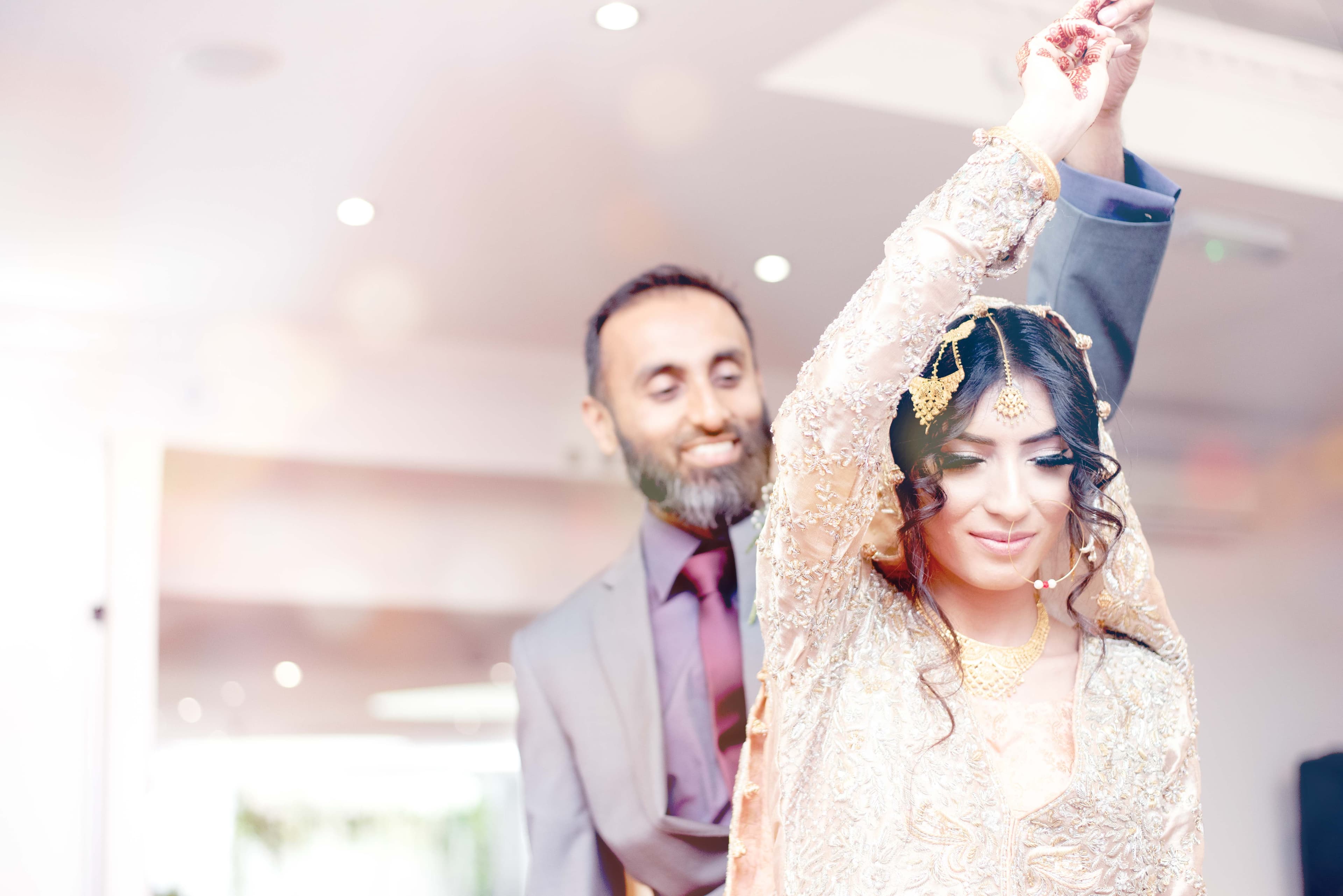 Elegant bride and groom dancing in perfect harmony