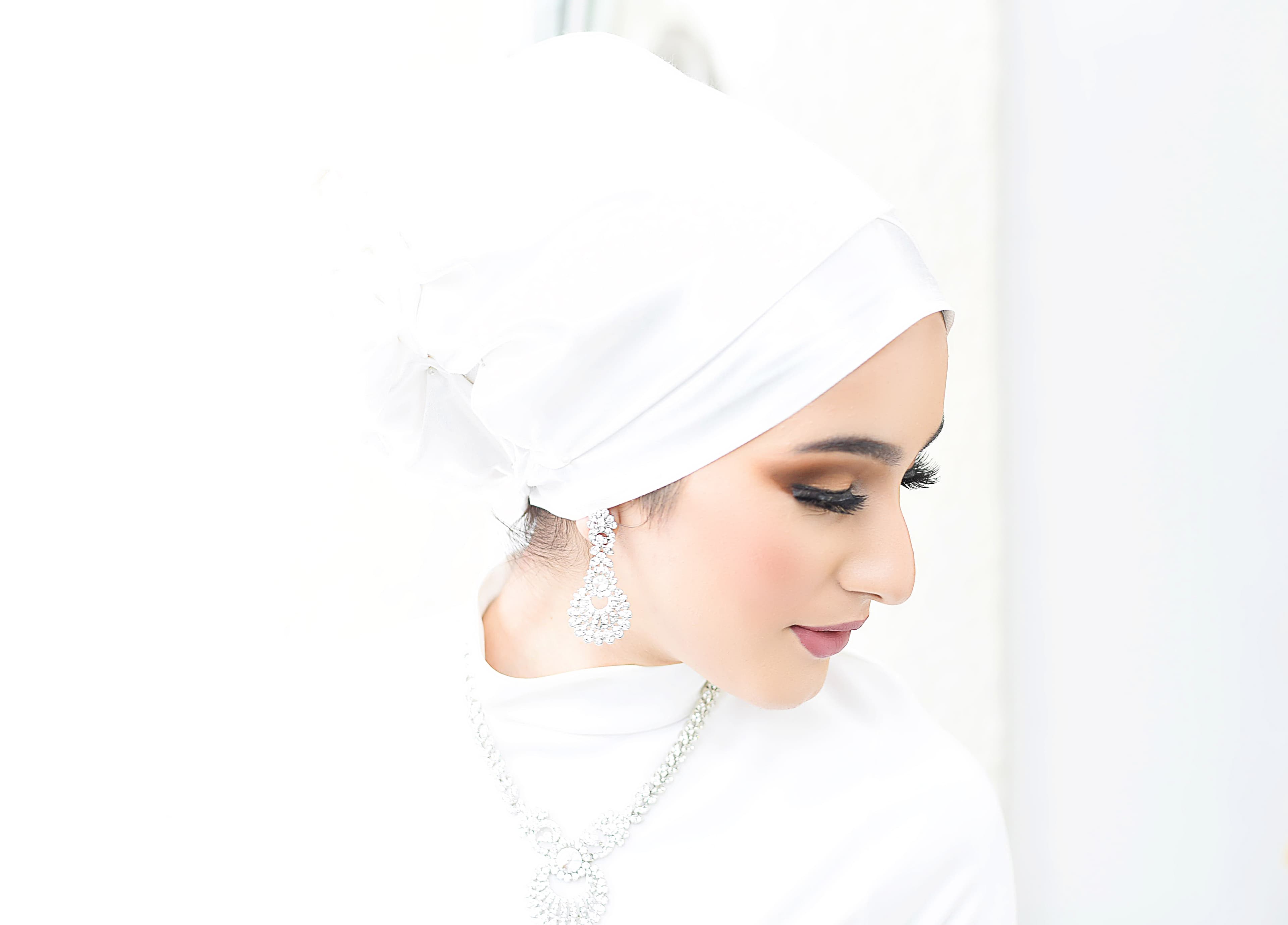 Elegant bride in a white wedding dress in radiant natural light