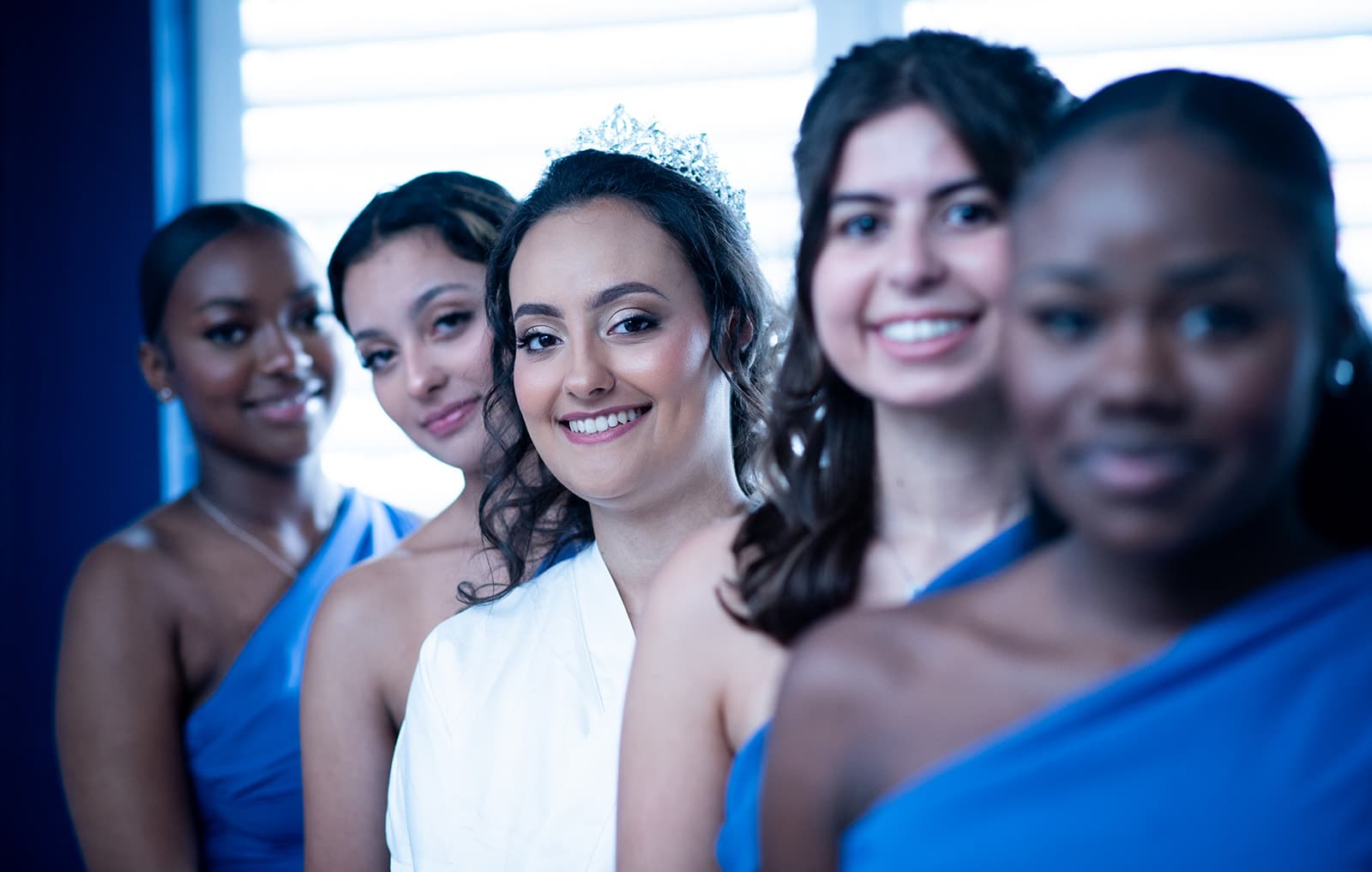 The bride posing with her bridesmaids