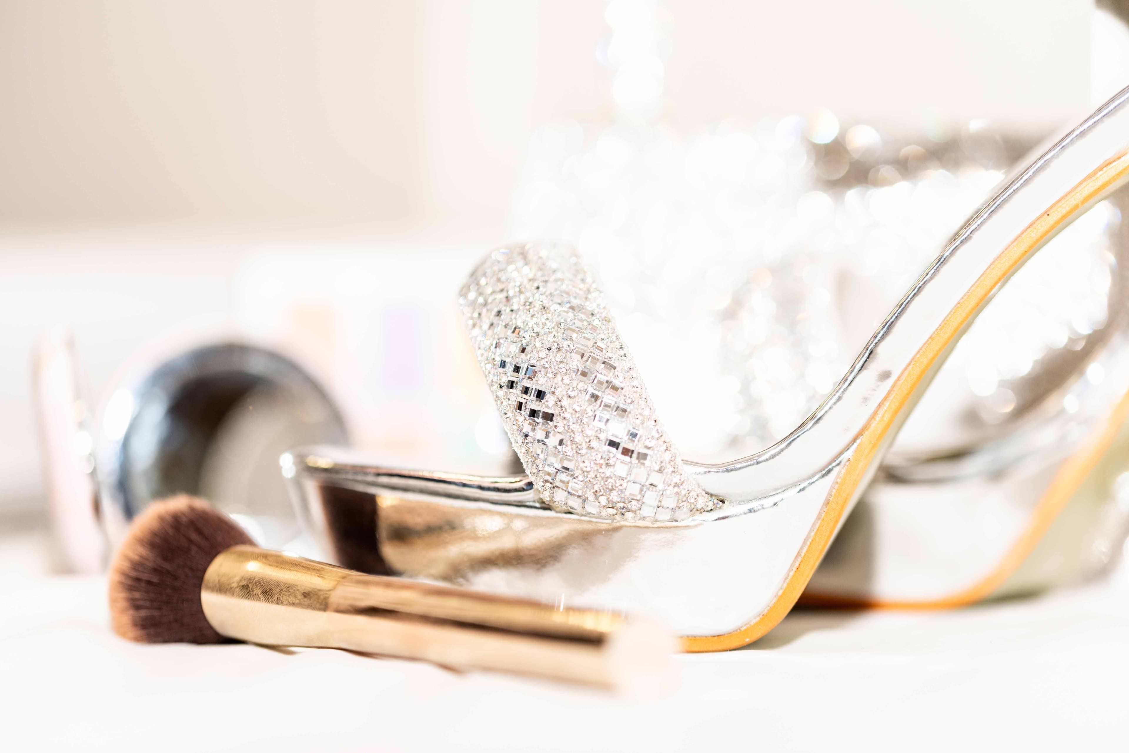 Wedding shoes and makeup brush